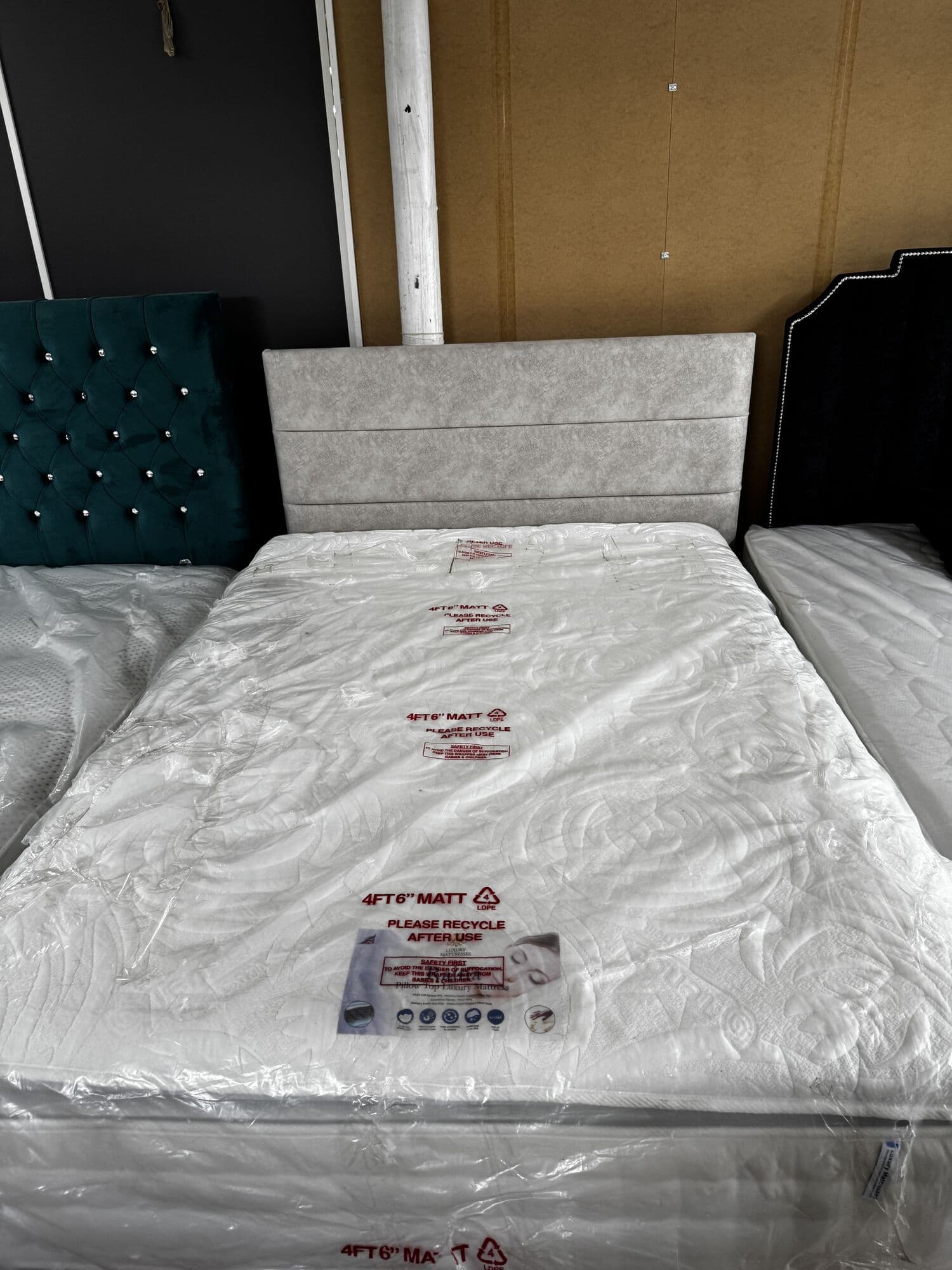 4ft 6in divan with pillow top mattress and panel headboard