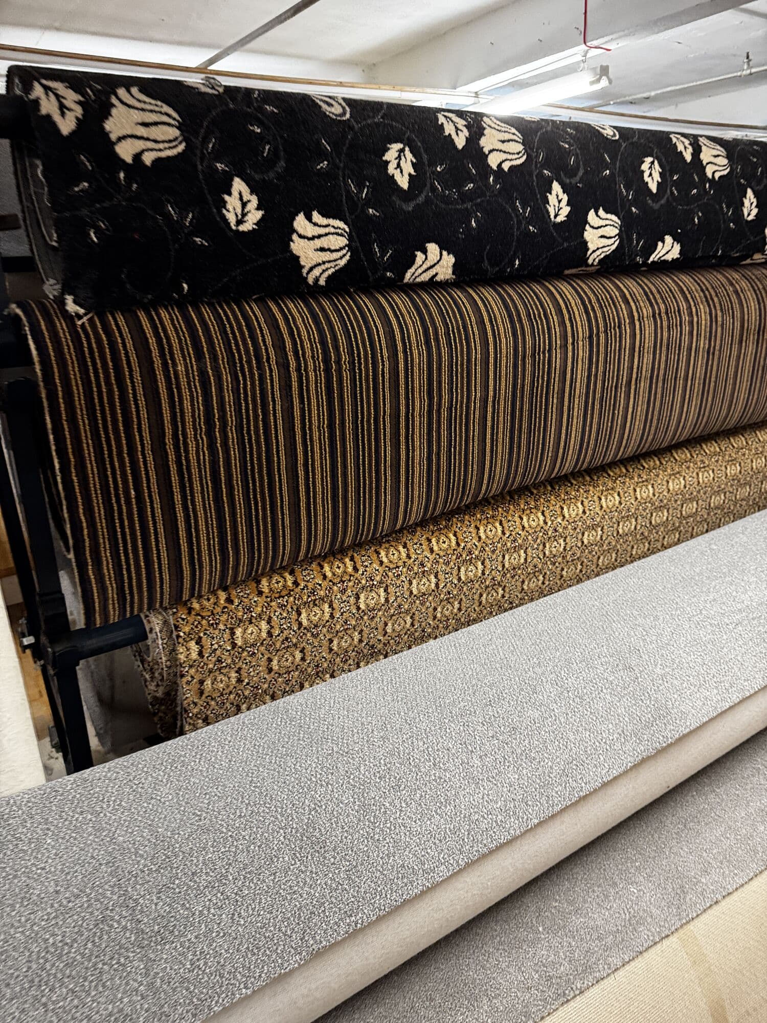 Floral, striped and ornate patterned carpet rolls