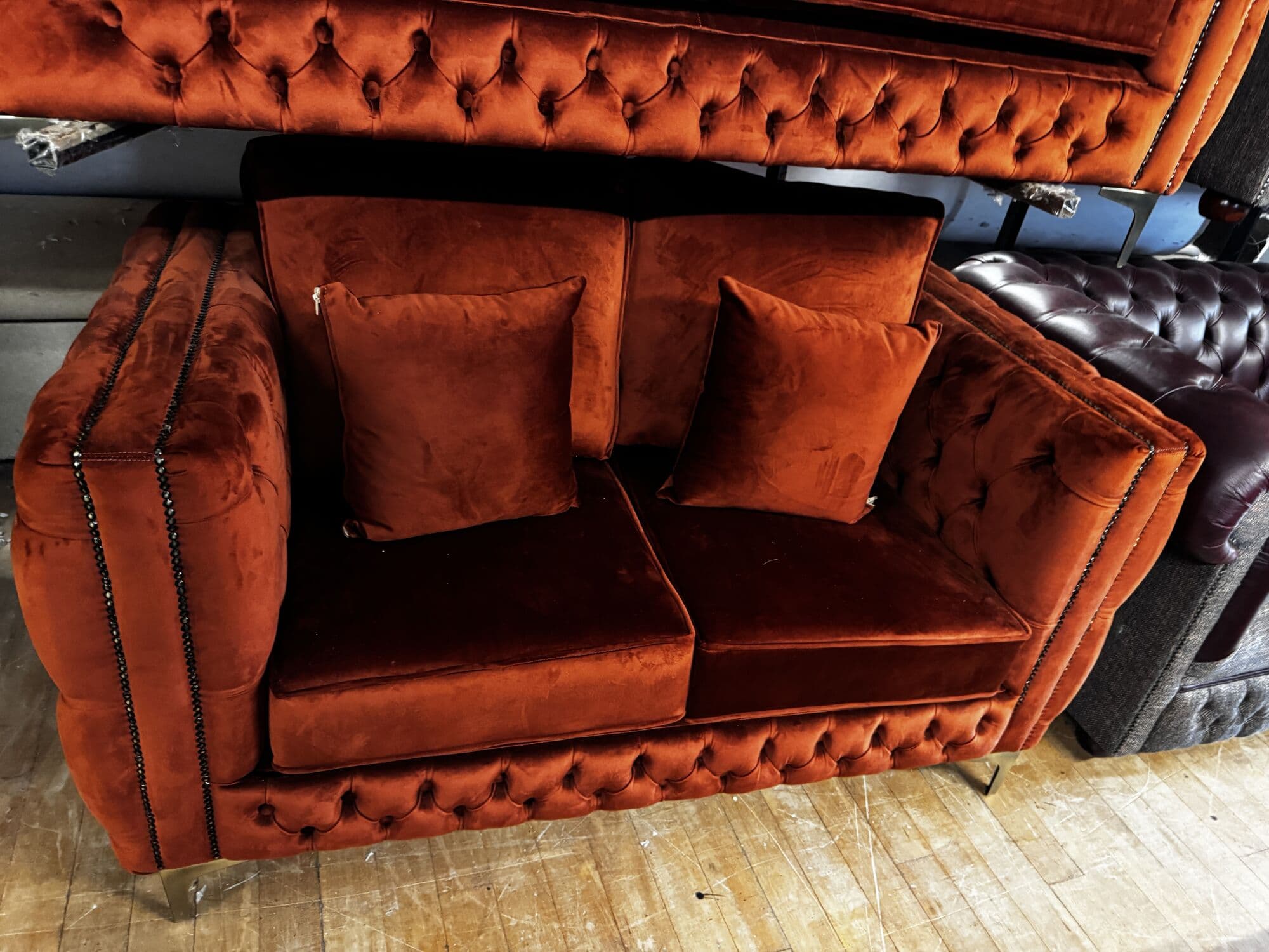Rust velvet chesterfield two seater with studded arms