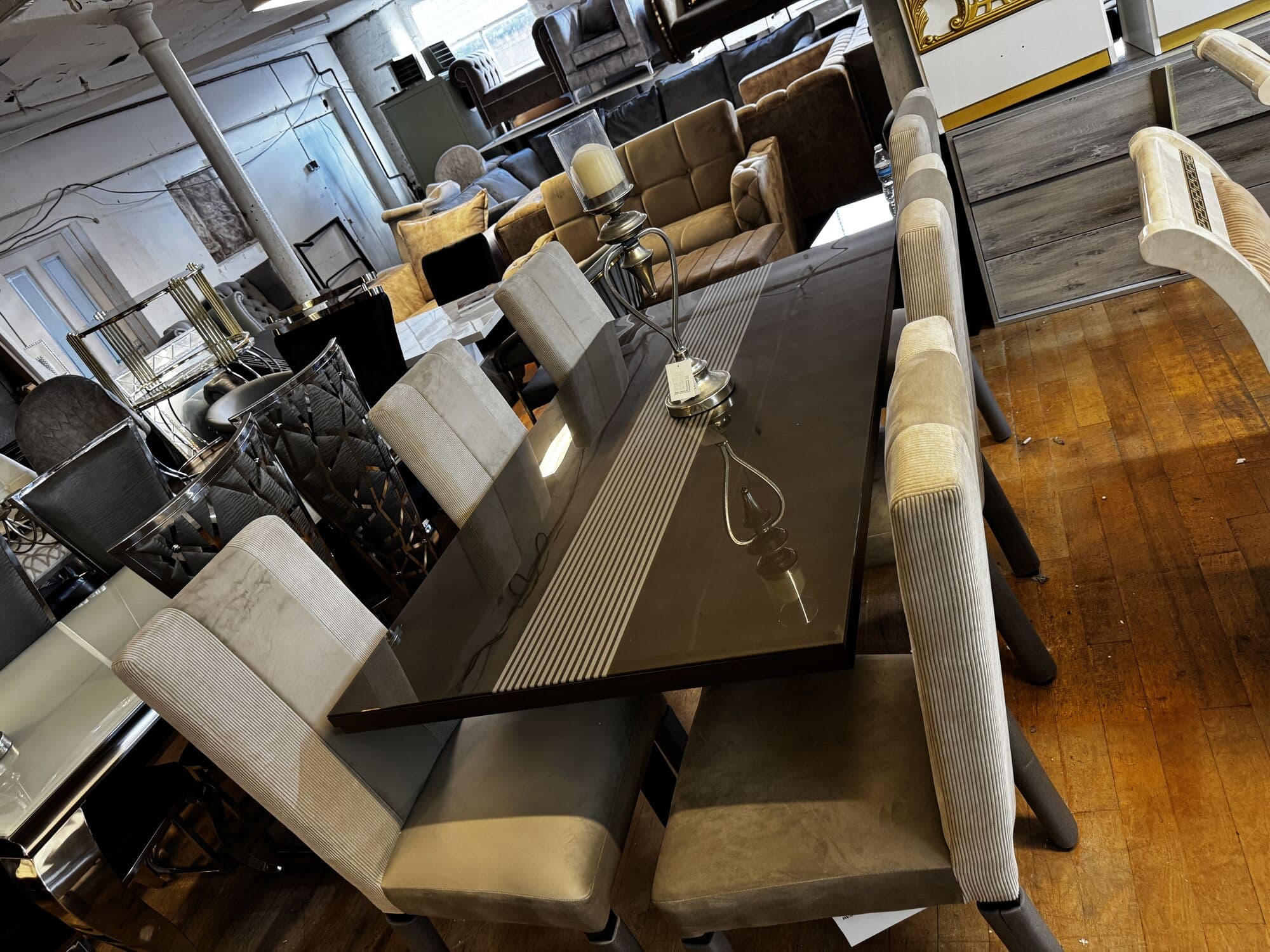 Gloss dining table with six upholstered chairs