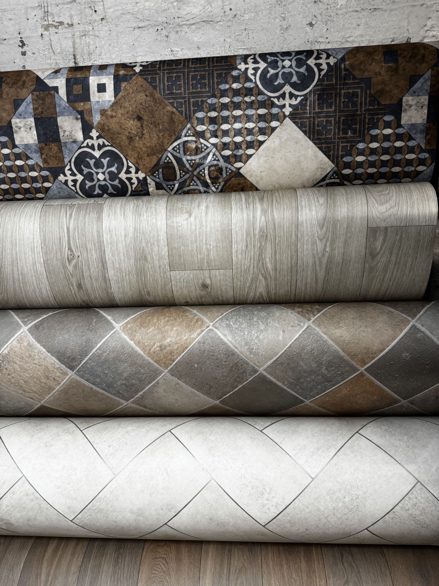 Rolls of tile effect and wood effect cushioned vinyl
